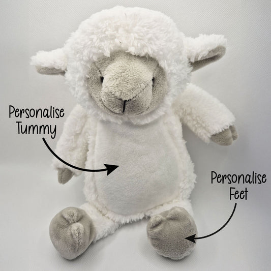 Plush lamb toy with text indicating areas to personalise on a light gray background