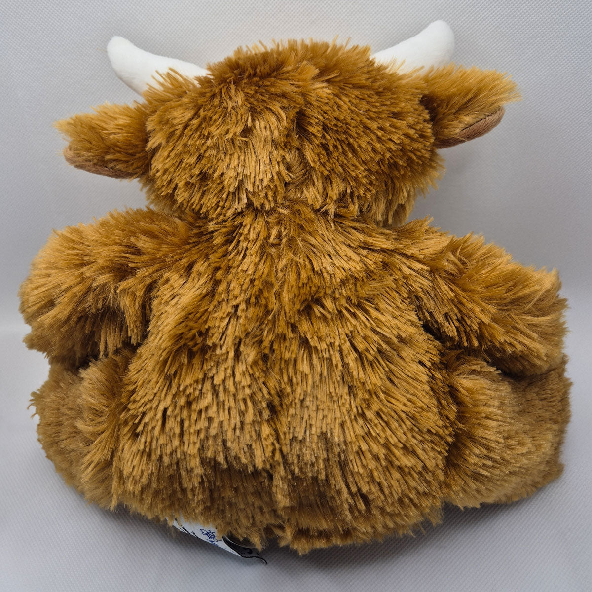 Brown highland cow personalised teddy plush toy with white horns on a gray background PHigh