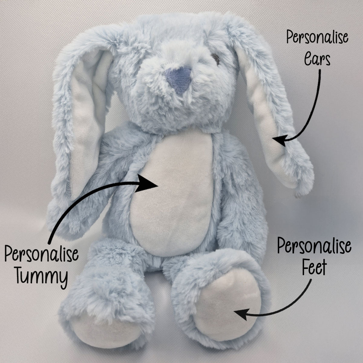 Blue plush bunny with text indicating areas to personalise on a light background
