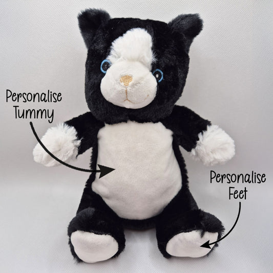 Black and white plush toy with text indicating areas to personalize on a light gray background