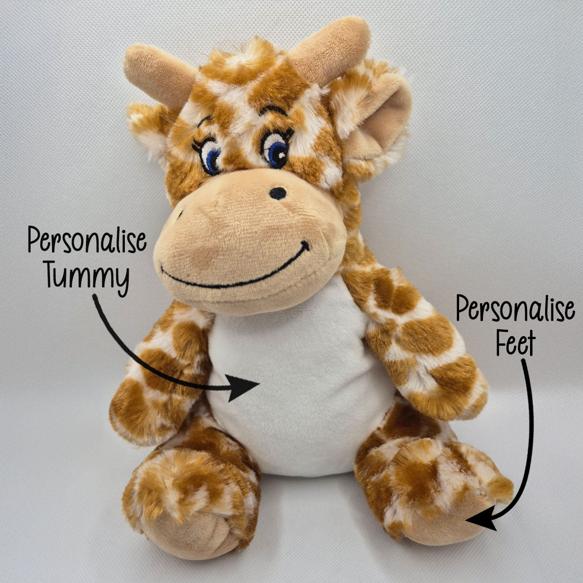 Plush giraffe teddy with text indicating areas to personalise on a white background