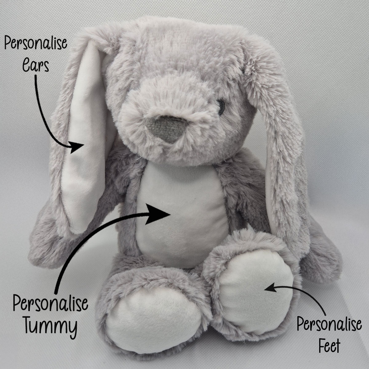 Grey plush bunny with text indicating parts to personalise on a light gray background