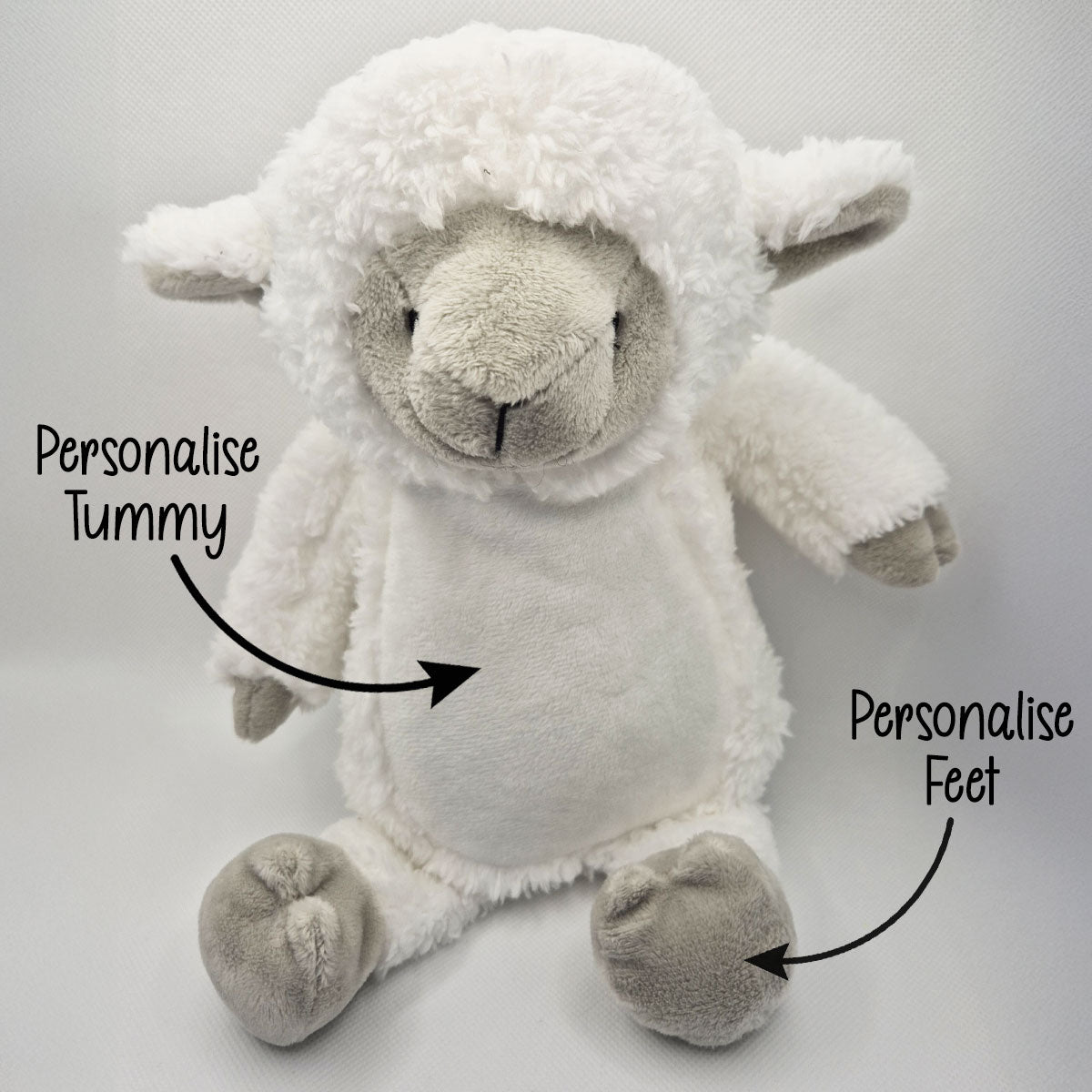 Plush lamb teddy with text indicating areas to personalise on a light gray background