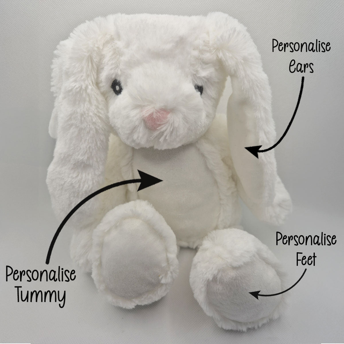 White plush bunny with text indicating areas to personalise on a grey background