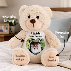 Personalised teddy bear with customisable text and photo on a bed