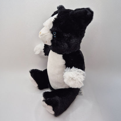 Black and white cat teddy on a light gray background