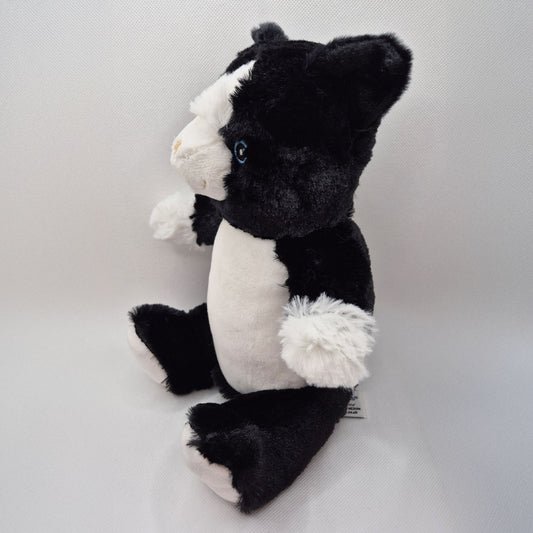 Black and white cat teddy on a light gray background